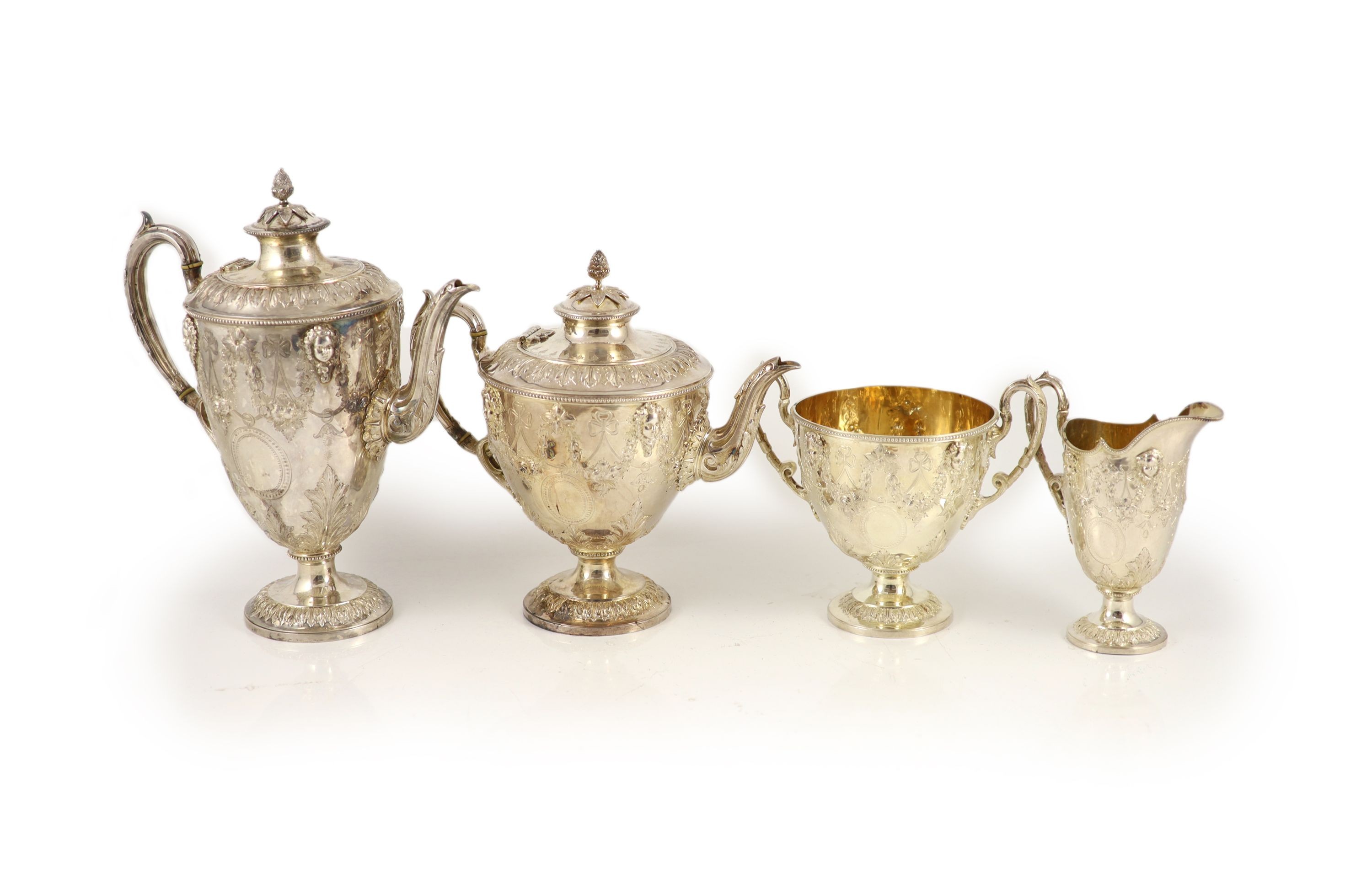 A Victorian embossed silver four-piece tea and coffee service of classical vase form, London 1886, Martin, Hall & Co (Richard Martin & Ebenezer Hall)